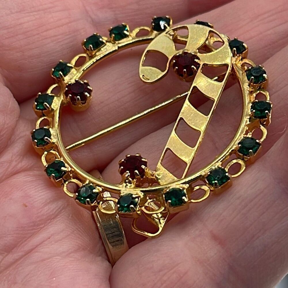 Vintage rhinestone wreath candy cane brooch.